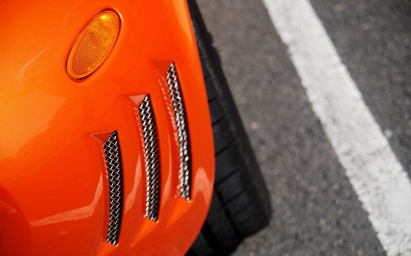 Close-up of orange car vent