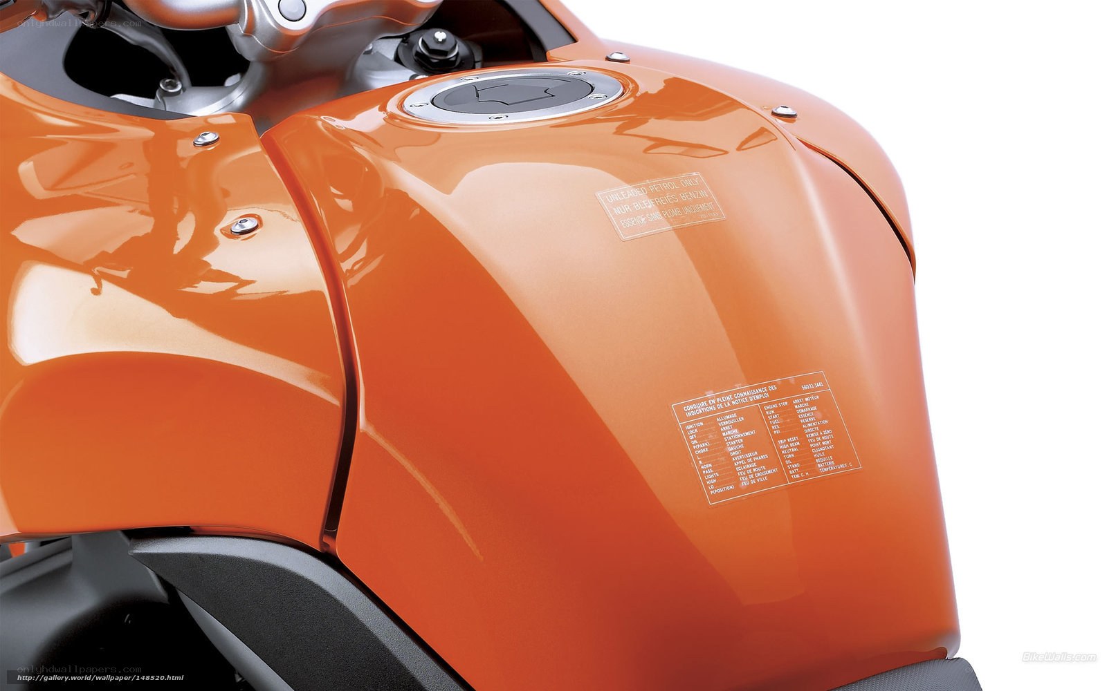 Close-up of orange motorcycle fuel tank