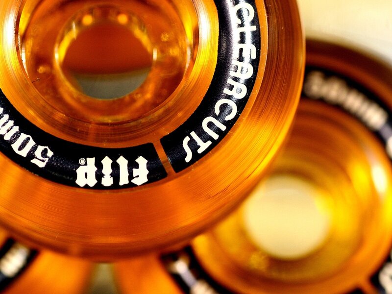 close-up of orange skateboard wheels