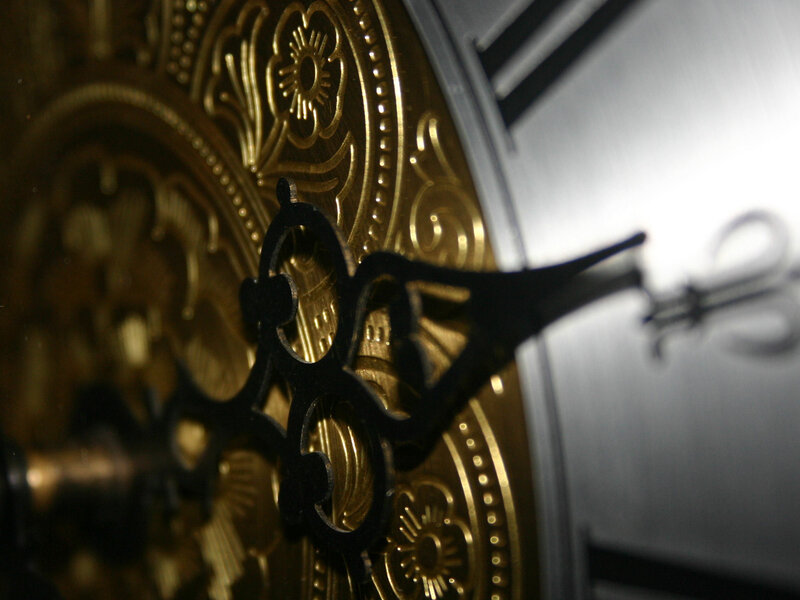 Close-up of ornate clock mechanism