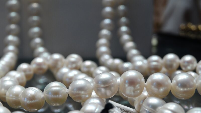 Close-up of pearl necklaces