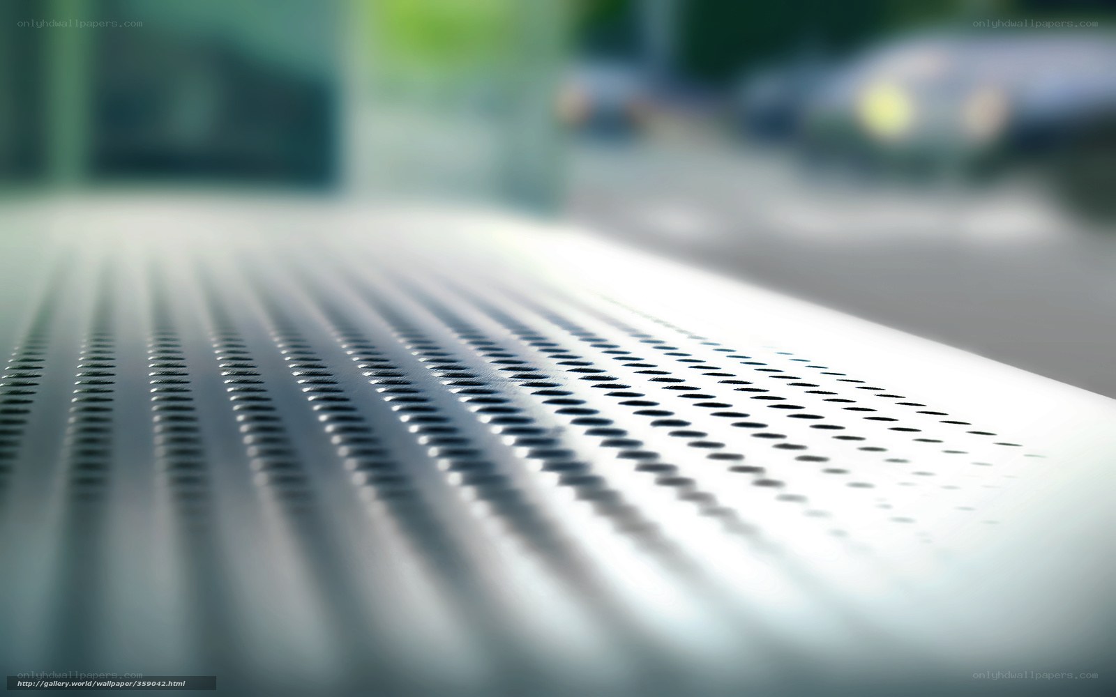 Close-up of perforated metal surface