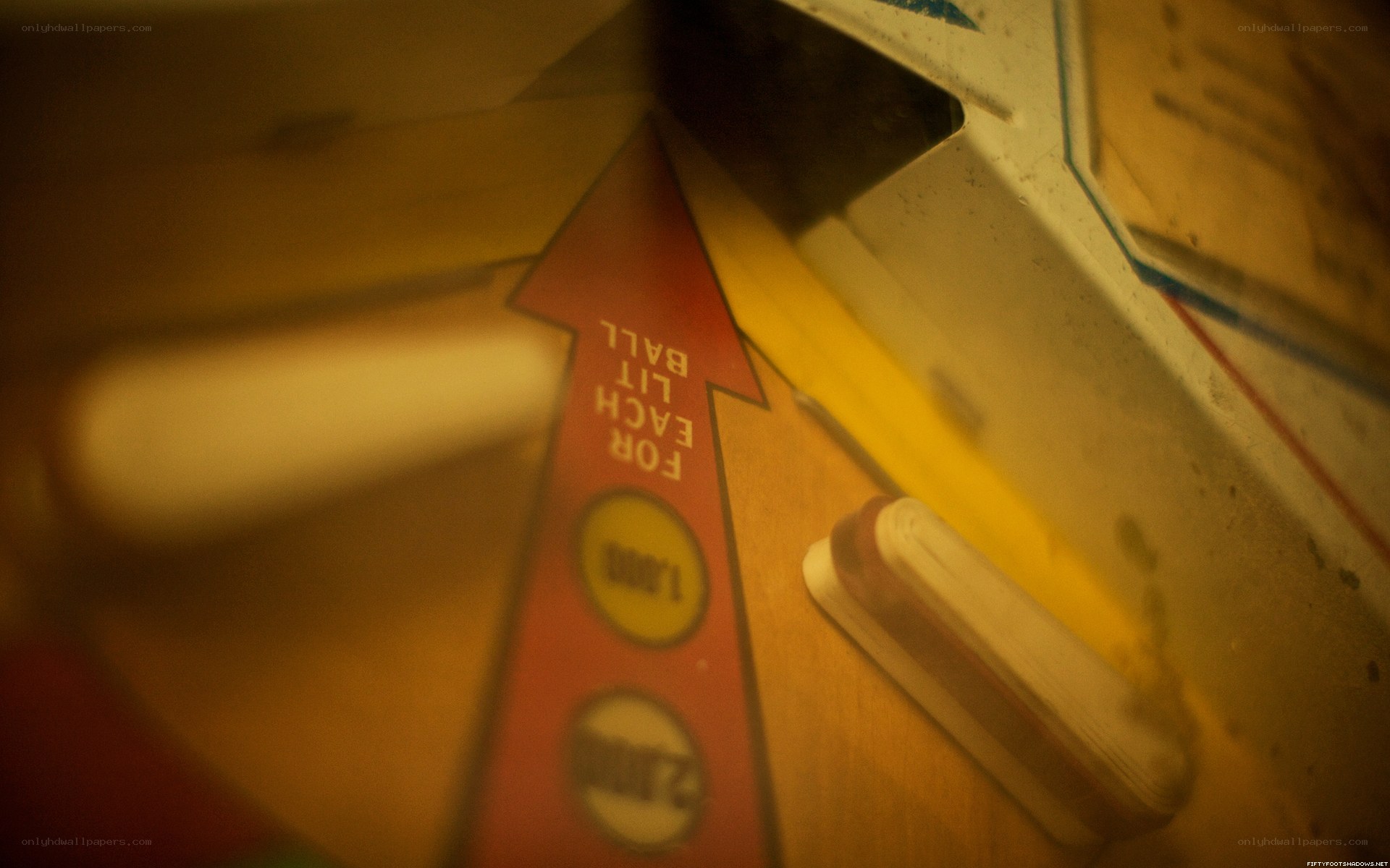 close-up of pinball machine arrow