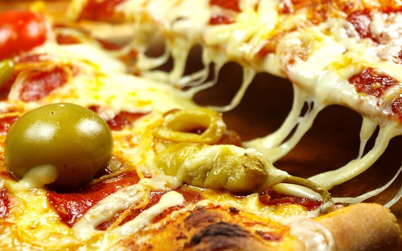 Close-up of Pizza Slice — Yellow