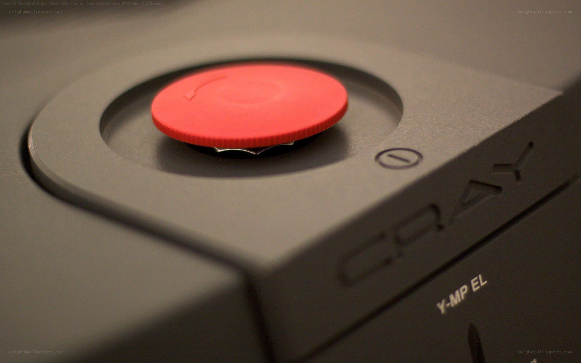 Close-up of red button on device