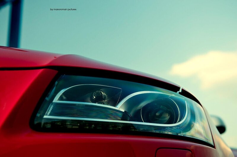 Close-up of red car headlight