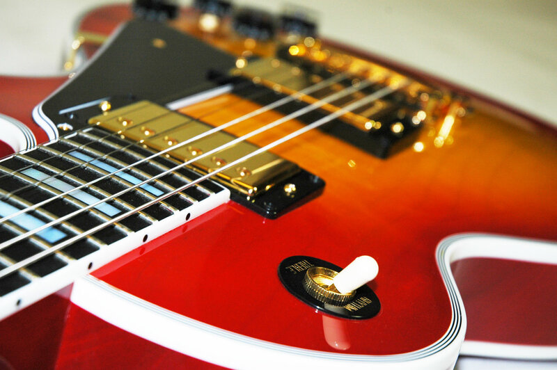 close-up of red electric guitar