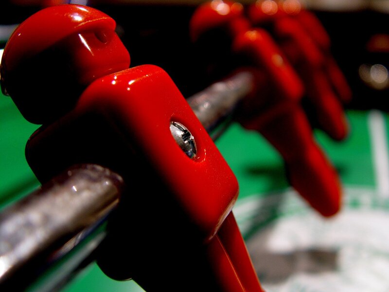 Close-up of red foosball players