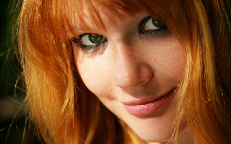 close-up of red-haired woman