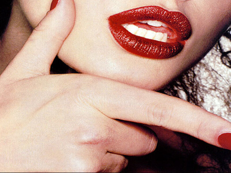 close-up of red lips and hand