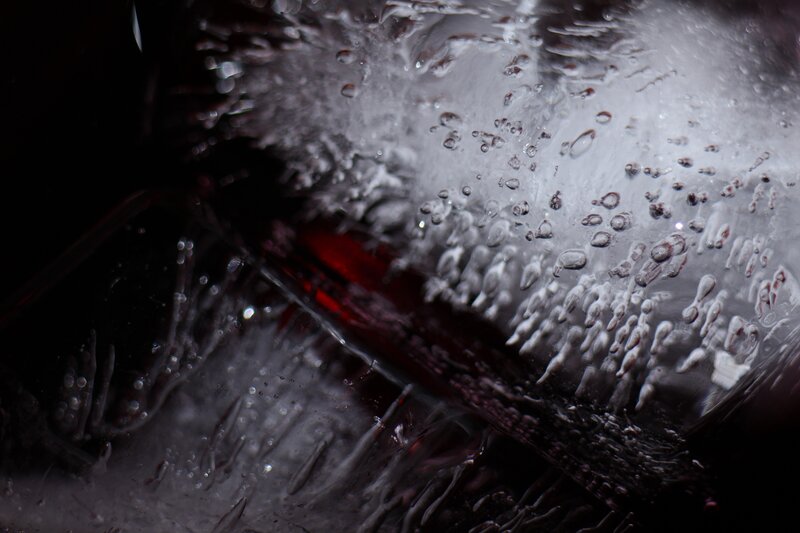 Close-up of red liquid in glass