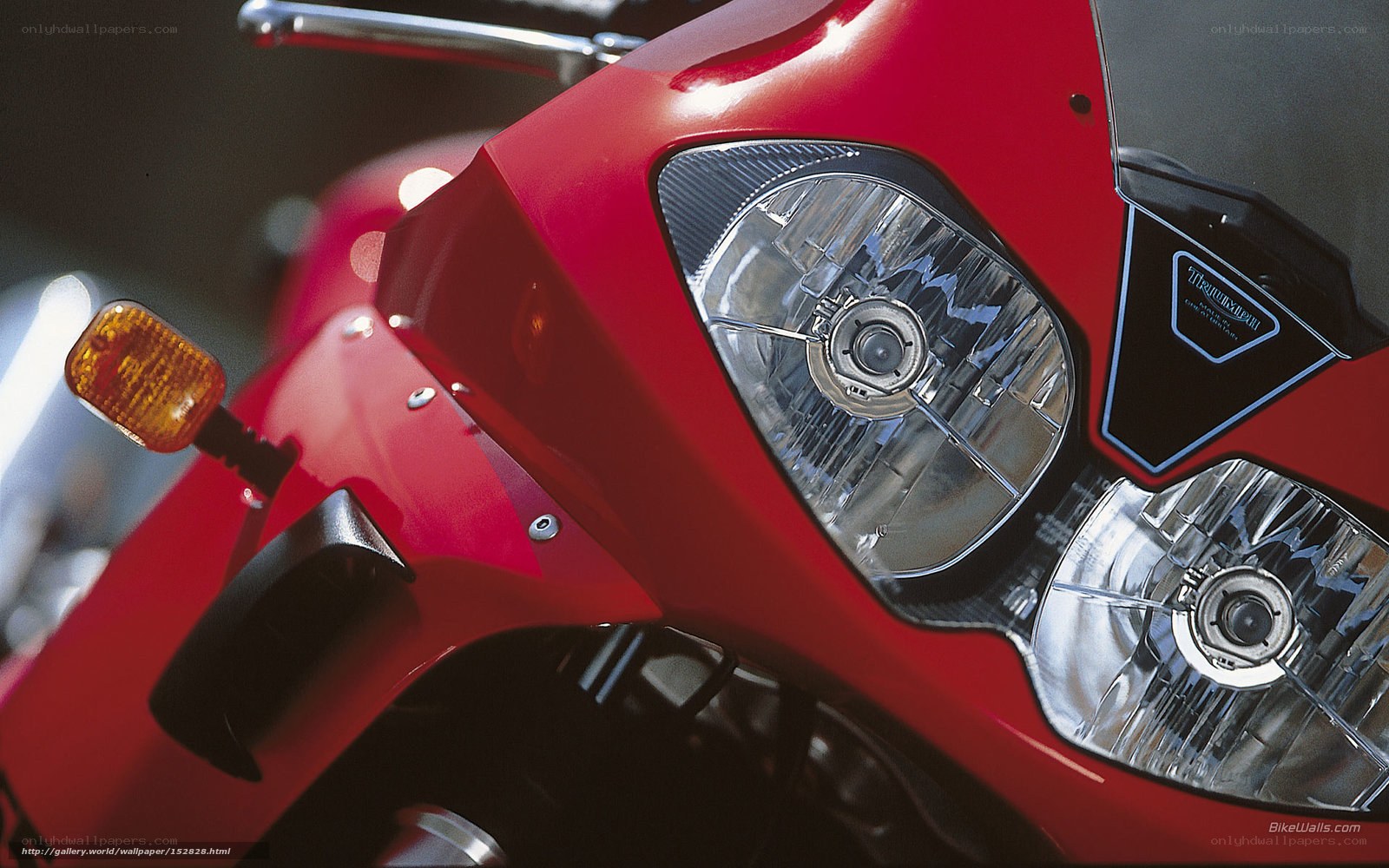 close-up of red motorcycle headlight