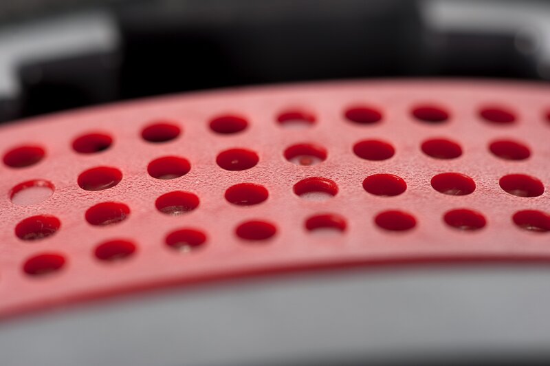 close-up of red perforated surface
