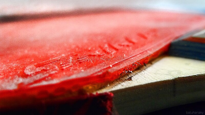 close-up of red table tennis paddle
