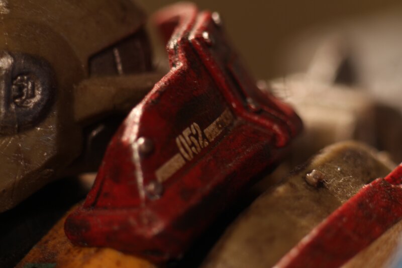 Close-up of Red Toy Parts — Dramatic