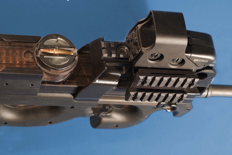 close-up of rifle with scope