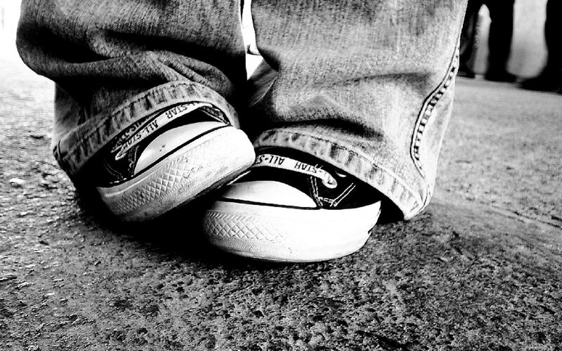 close-up of sneakers and jeans