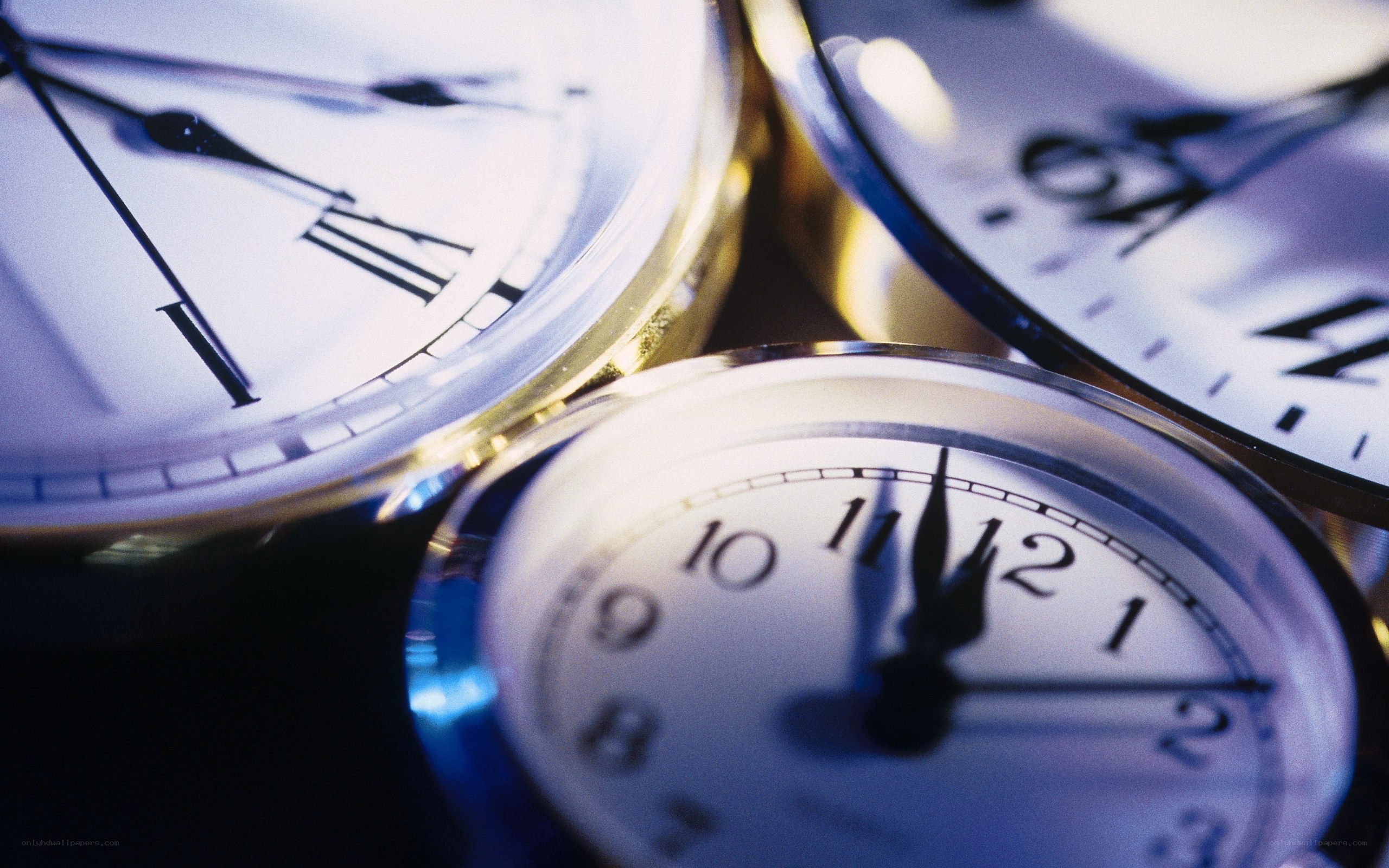 Close-up of three clocks
