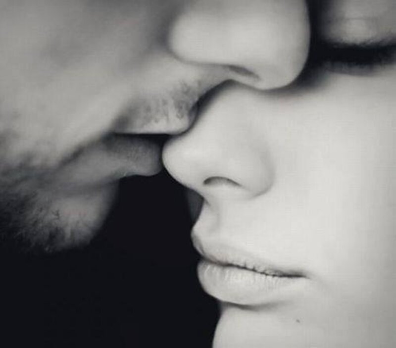 Close-up of Two Faces — Black, Intimate, Photograph