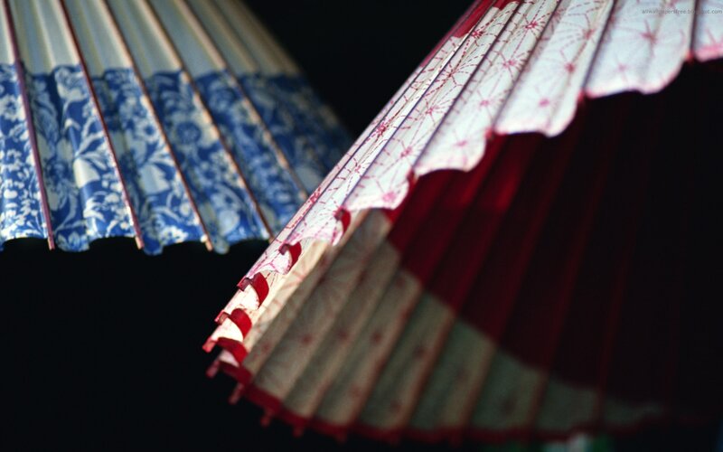 Close-up of Two Paper Umbrellas
