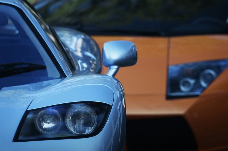 Close-up of two sports cars