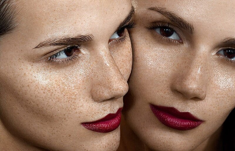 Close-up of two women with freckles