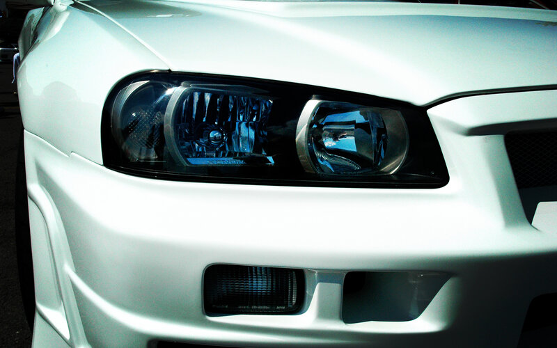 close-up of white car headlights