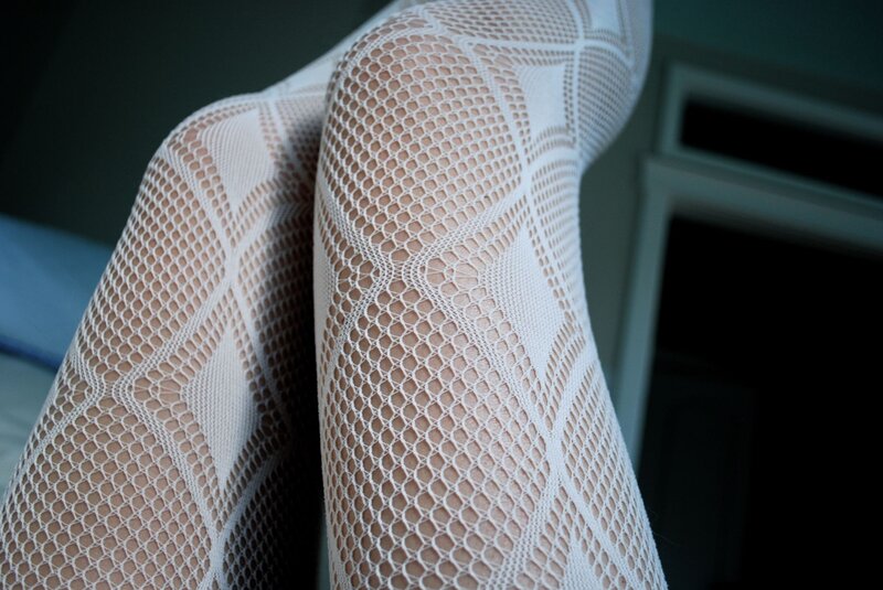 close-up of white fishnet stockings