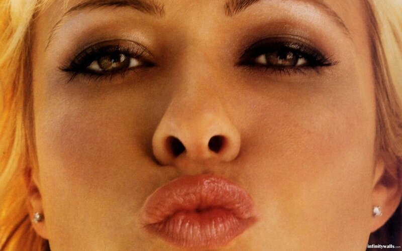 close-up of woman making kiss face
