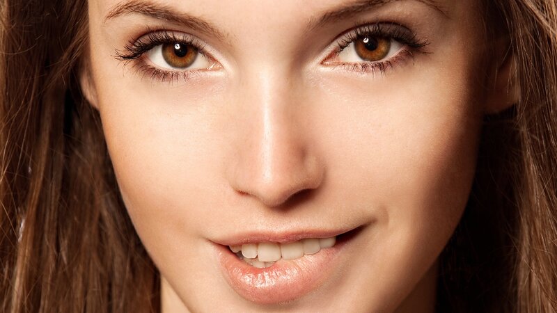 Close-up of Woman's Face — Brown, Neutral, Photograph, Eyes, Hair, Smile, Beige