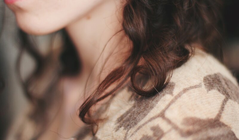 close-up of woman's hair and shoulder
