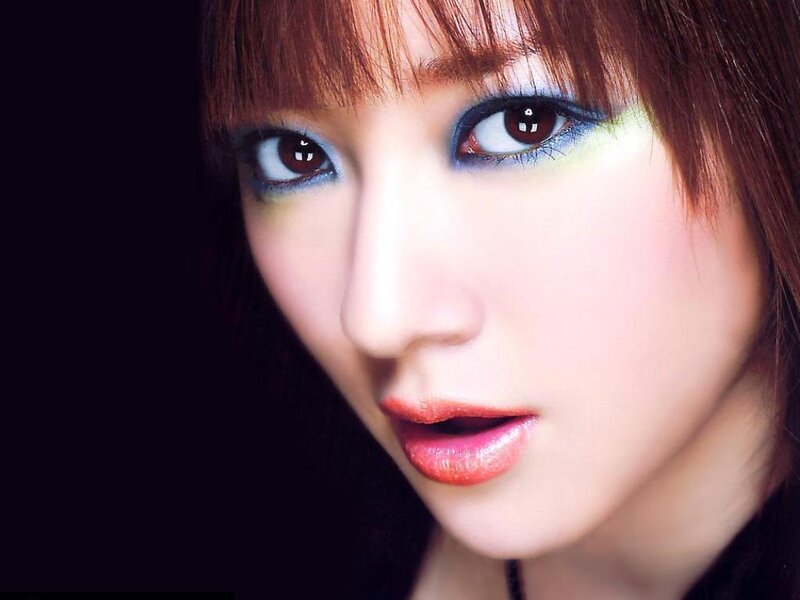 close-up of woman with colorful makeup