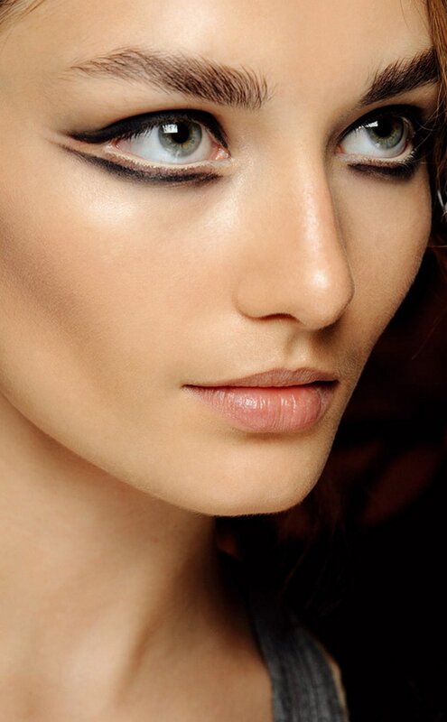 close-up of woman with dramatic eye makeup