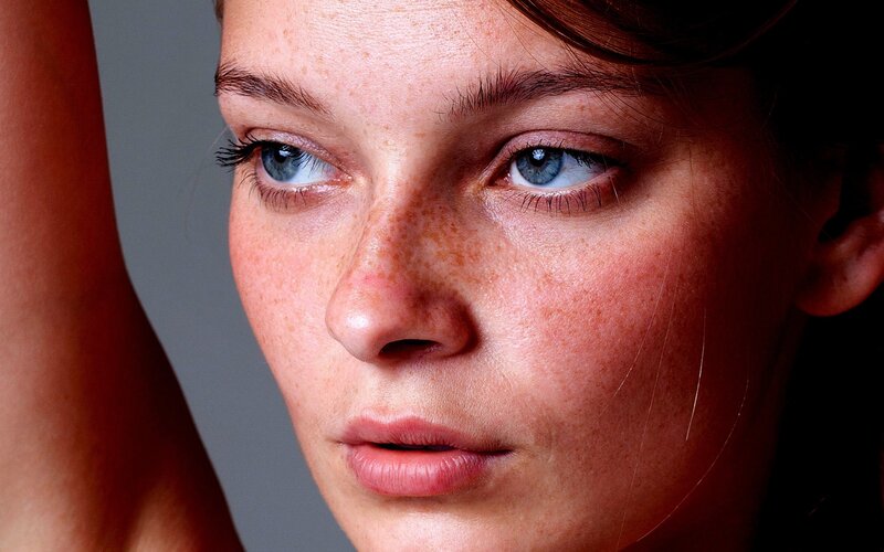 close-up of woman with freckles
