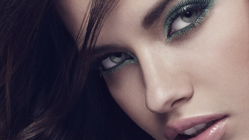close-up of woman with green eyeshadow