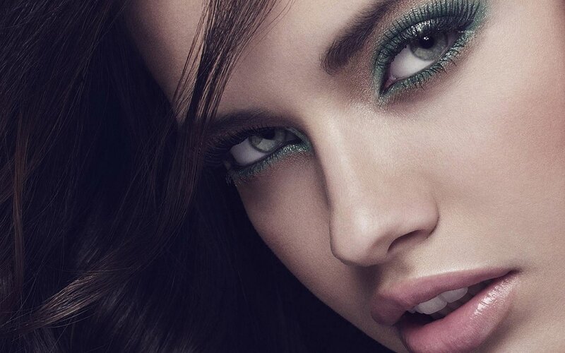 close-up of woman with green eyeshadow