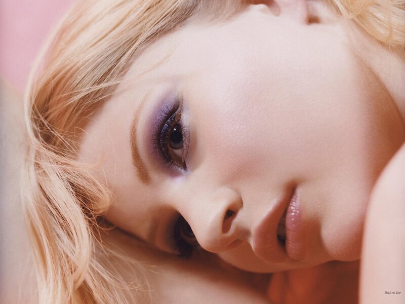 close-up of woman with purple makeup