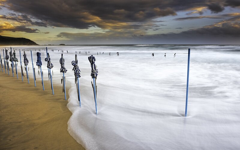 Closed Beach Umbrellas — Blue, Dramatic