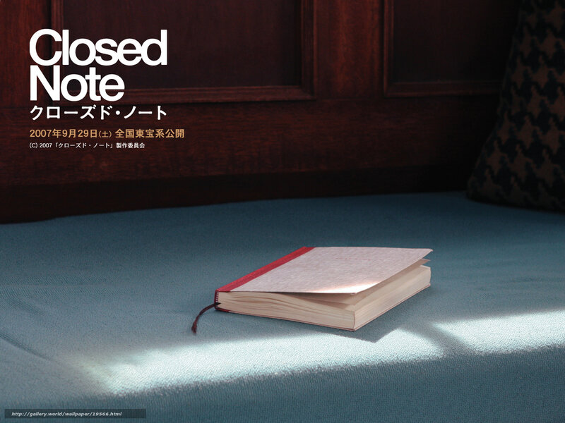 Closed Note book on blue fabric