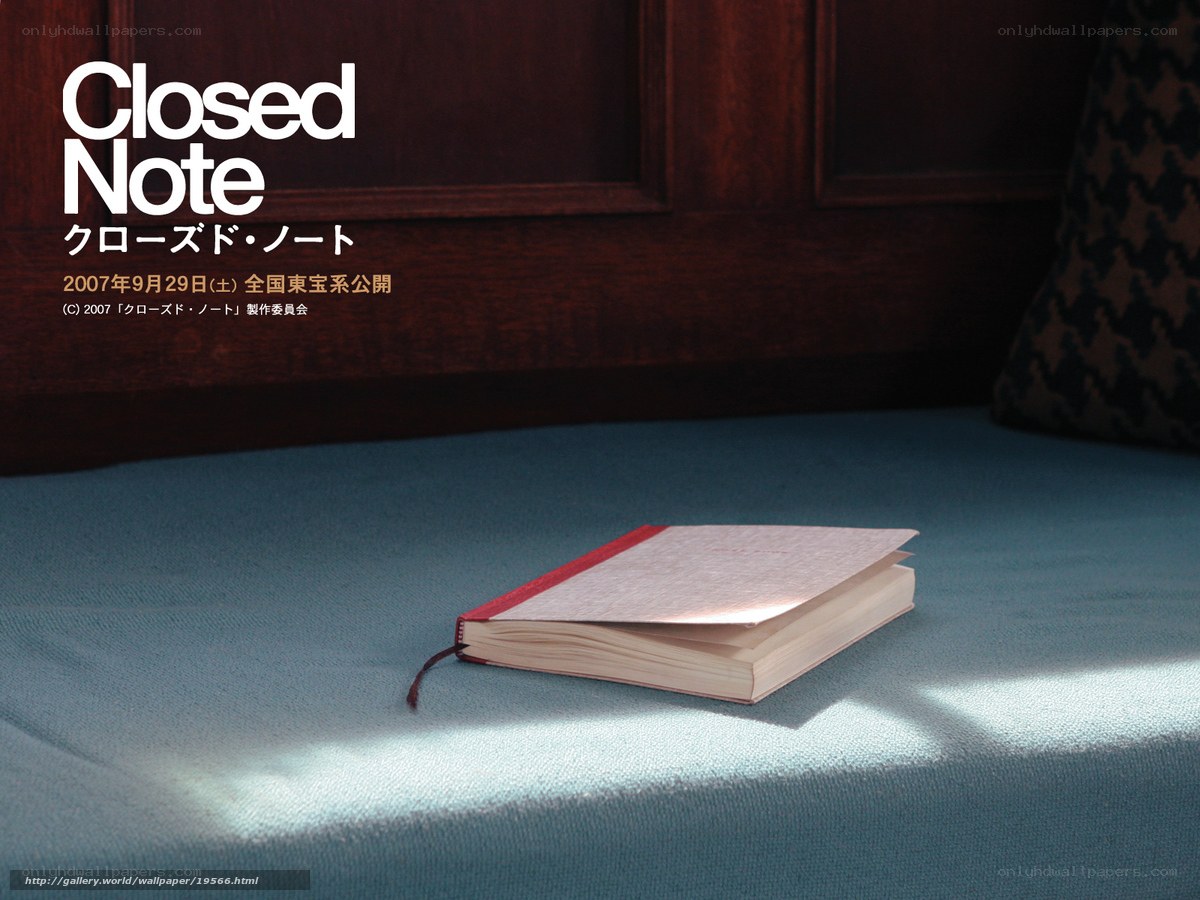 Closed Note book on blue fabric
