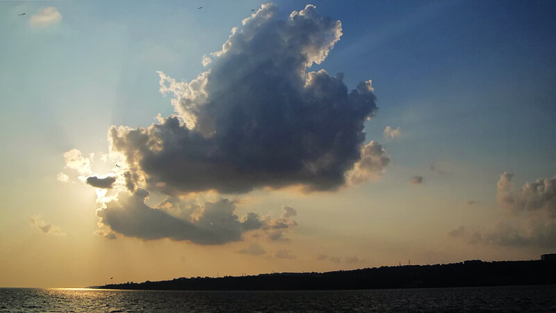 Cloud over Water at Sunset
