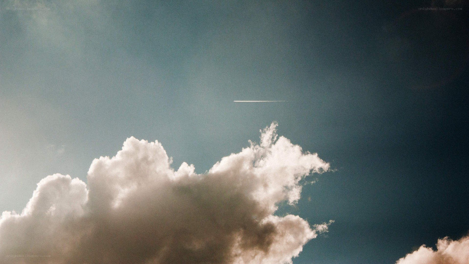 clouds and contrail in sky