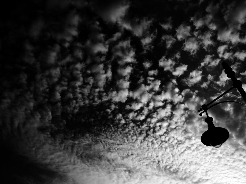 Clouds and street lamp silhouette