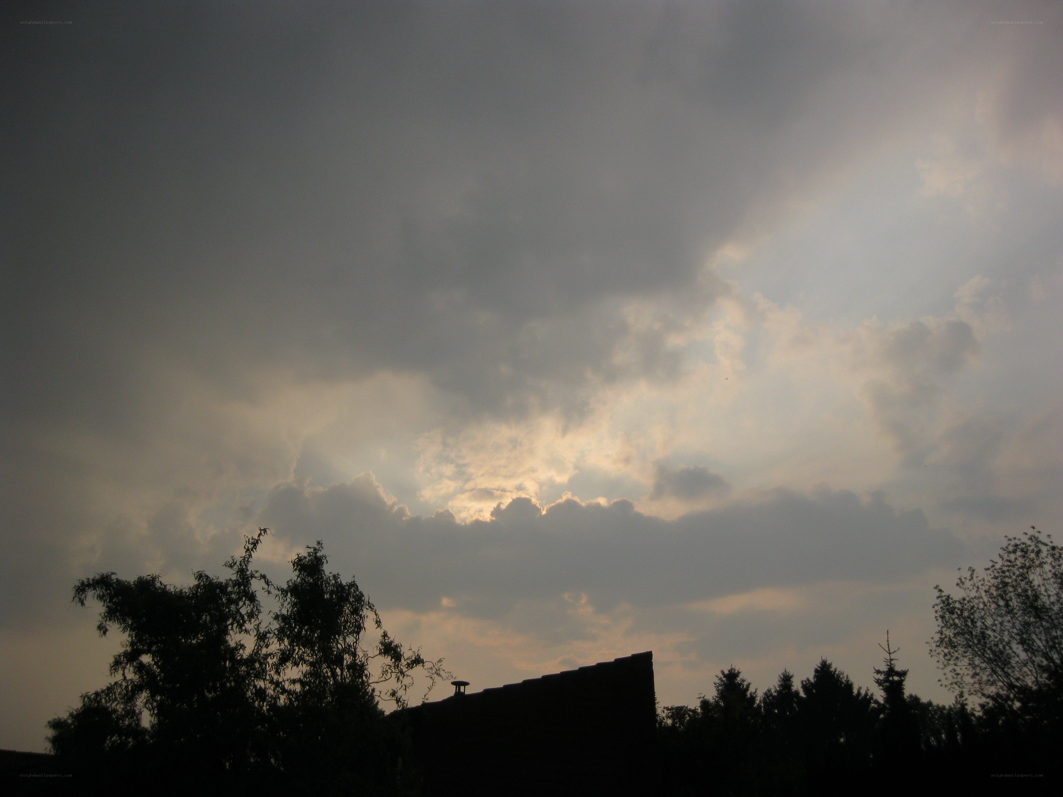 clouds at dusk with sunbeams