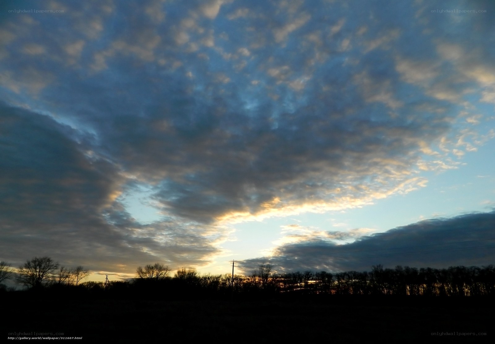 Clouds at Sunset Over a Field