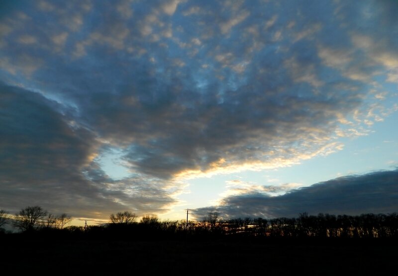 Clouds at sunset over a field