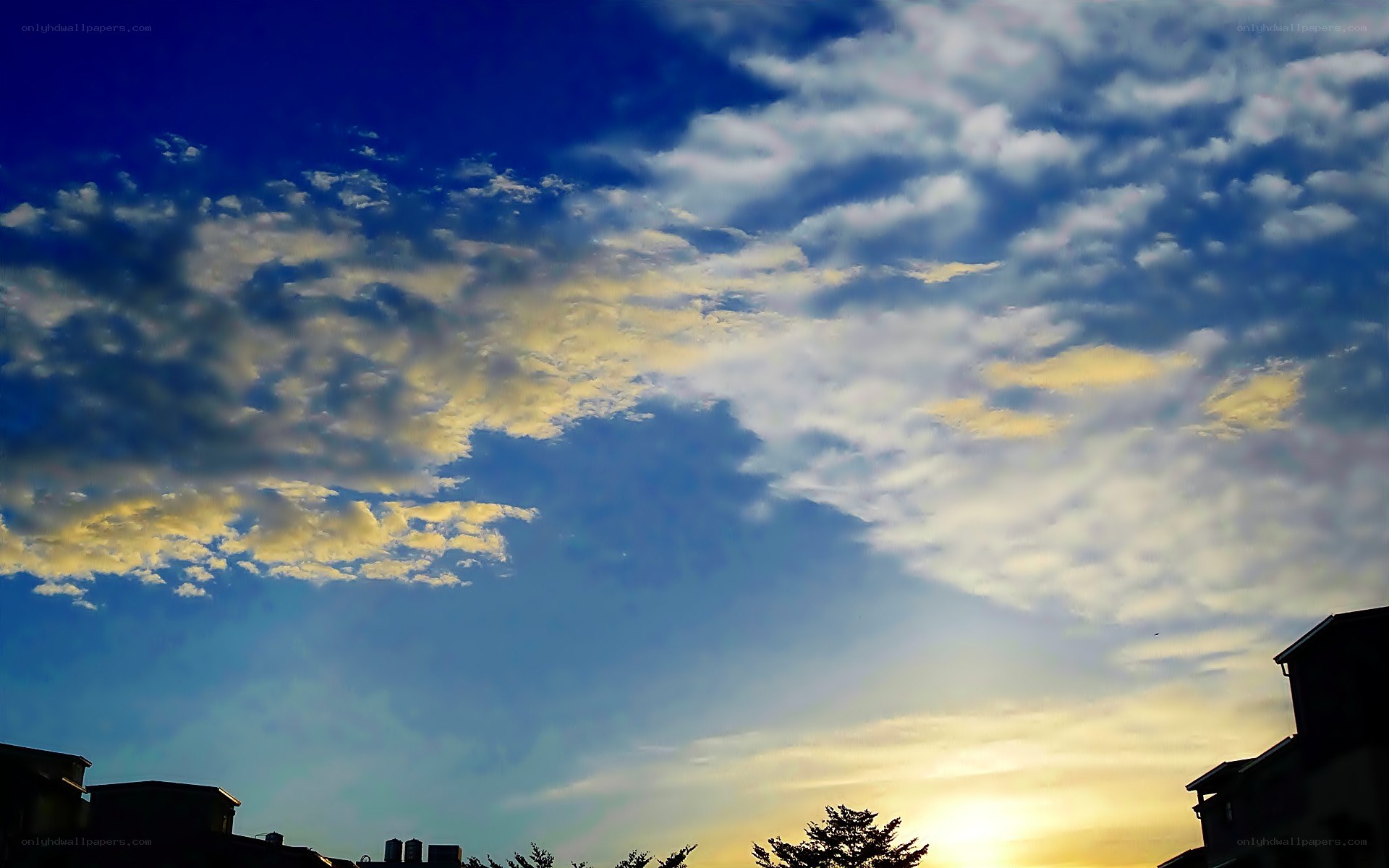 clouds at sunset over rooftops