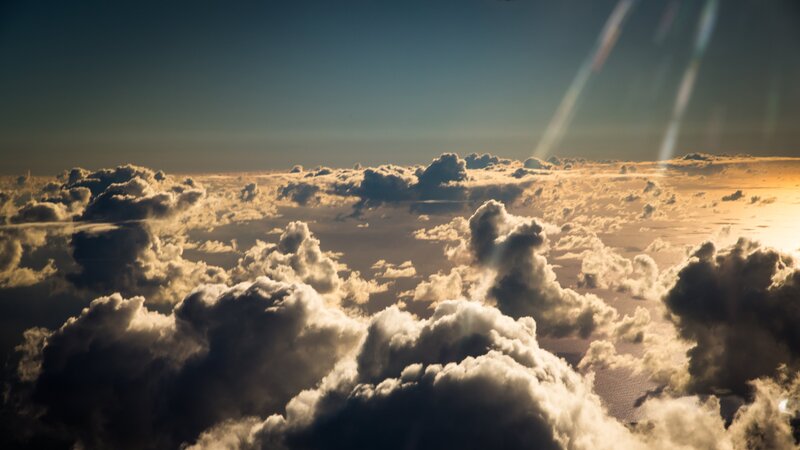 Clouds from Above — Blue, Dramatic, Sunset, Photograph, Sky, Sunlight, Lens Flare