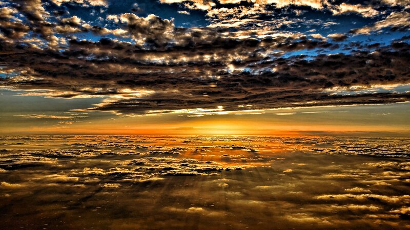 Clouds from Above — Orange, Dramatic, Sunrise