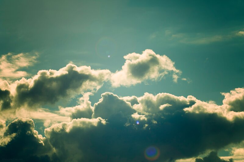 clouds in a teal sky